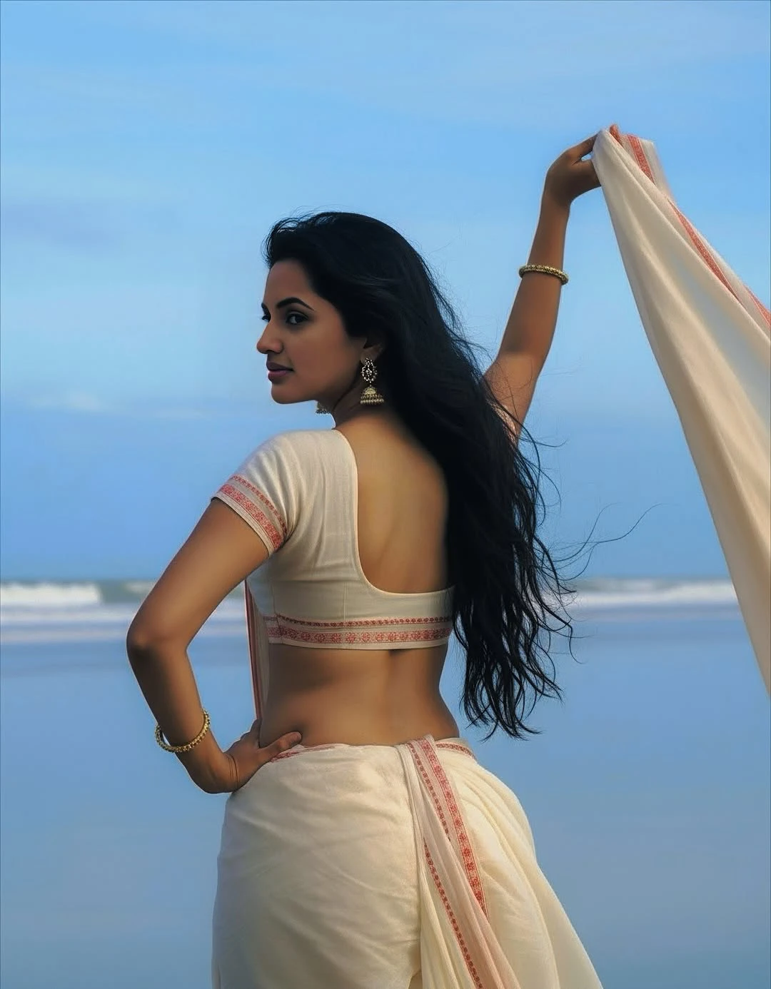 JyotiPoorvaj Stunning Looks in White Saree at Beach