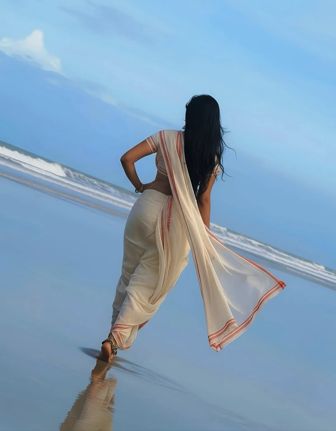 JyotiPoorvaj Stunning Looks in White Saree at Beach