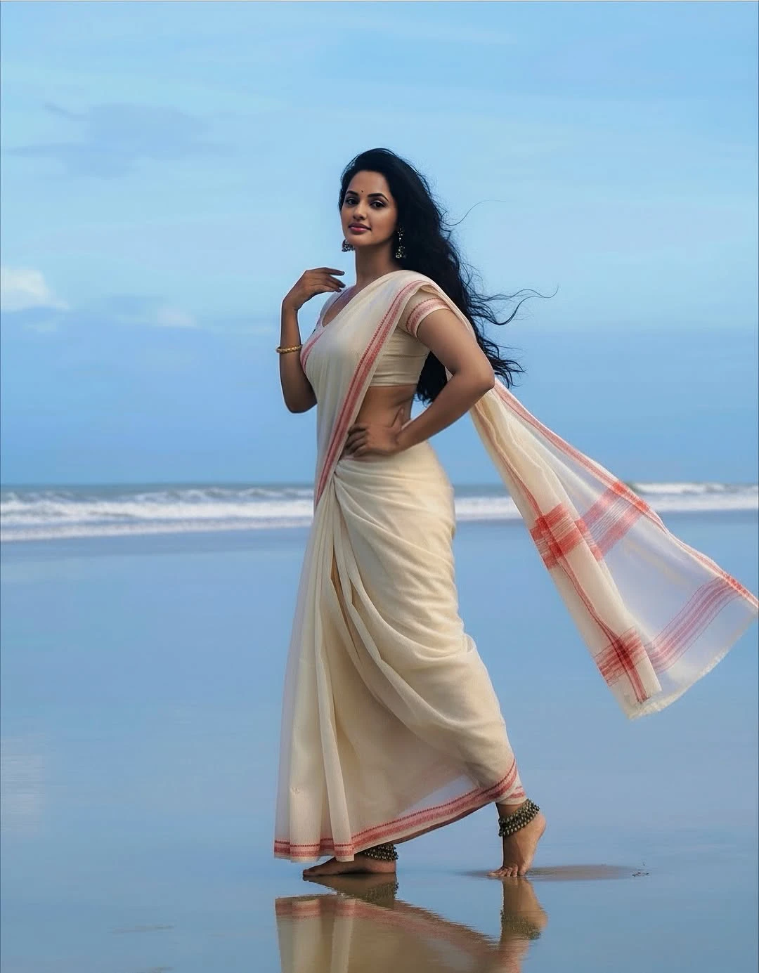 JyotiPoorvaj Stunning Looks in White Saree at Beach