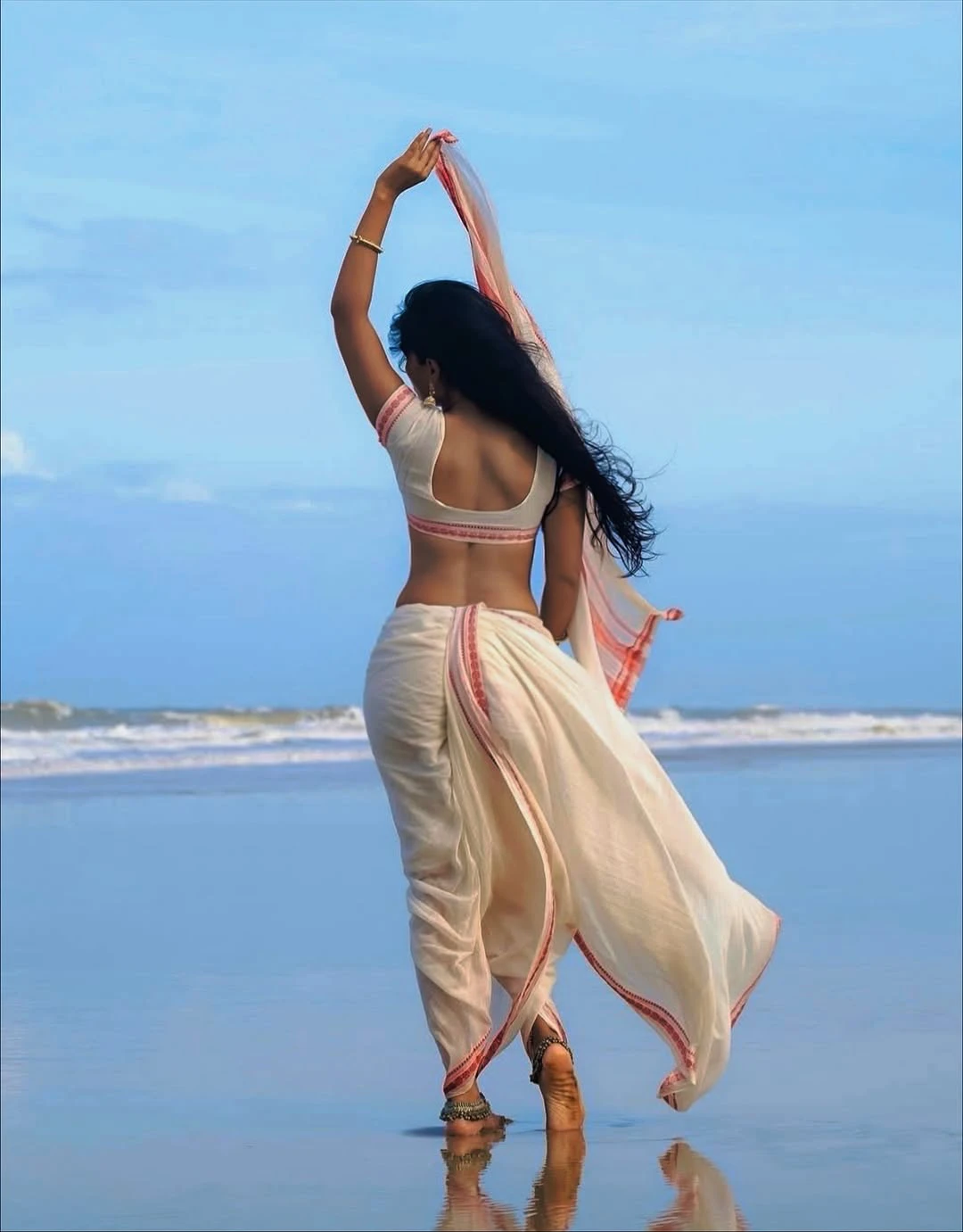 JyotiPoorvaj Stunning Looks in White Saree at Beach